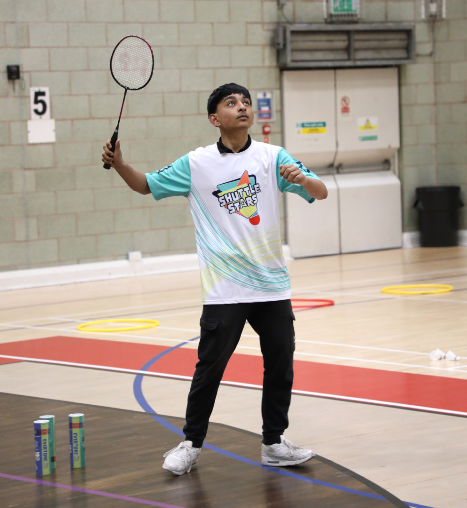 Young person playing badminton